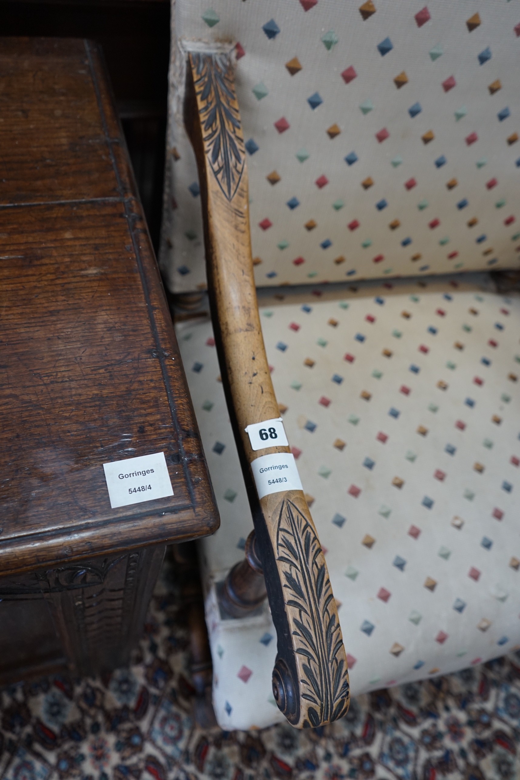 A French carved walnut upholstered elbow chair, width 61cm, depth 54cm, height 110cm